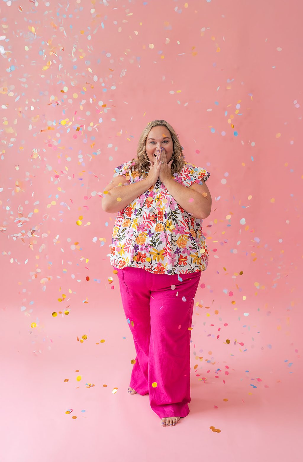 Kelly Hammond celebrating in a shower of confetti.